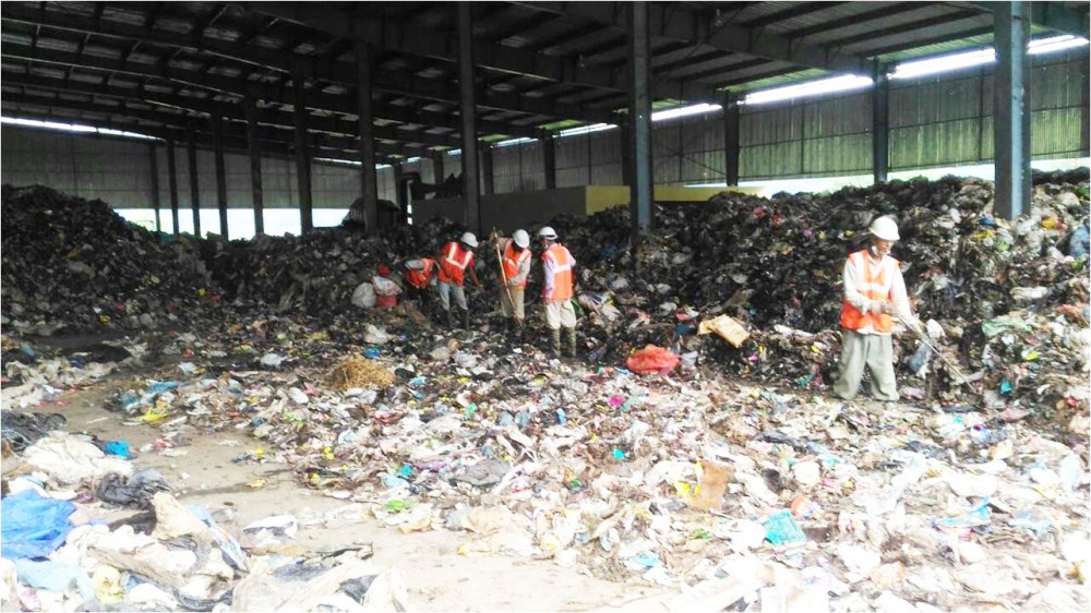 Pre sorting unsegregated waste at the solid waste management site in Lerie, Kohima. (KMC Photo)